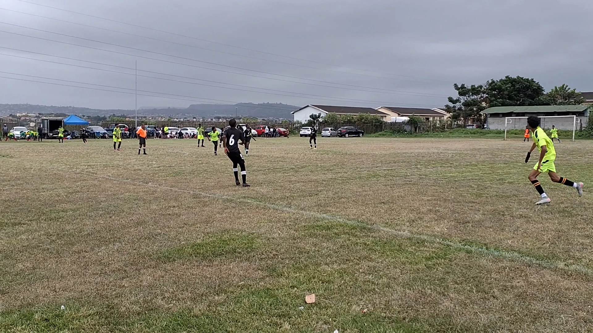 Soccer stadium during an action-packed match with players running across the field